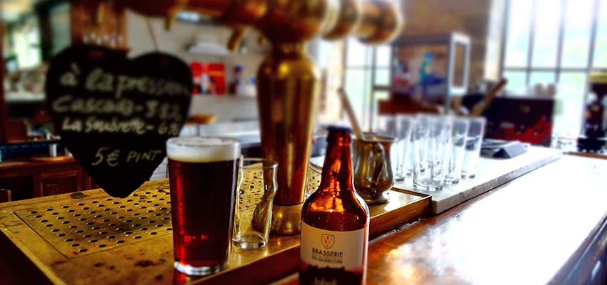 Cheers with French craft beer on a walking trip with Sherpa Expeditions